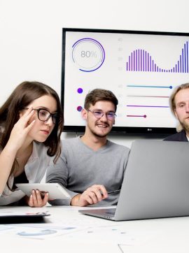 A diverse group of young professionals collaborating in a modern office environment.